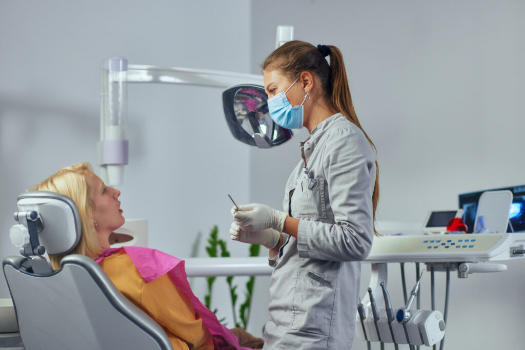 Dentist and patient at clinic