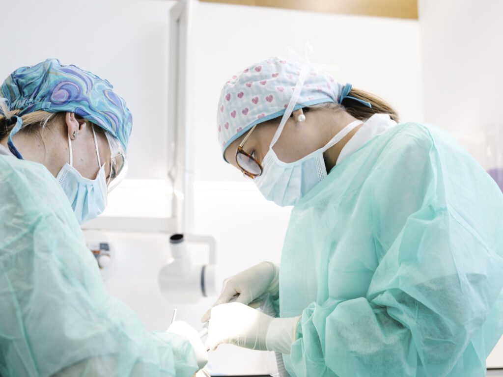 Dentists making surgery in clinic